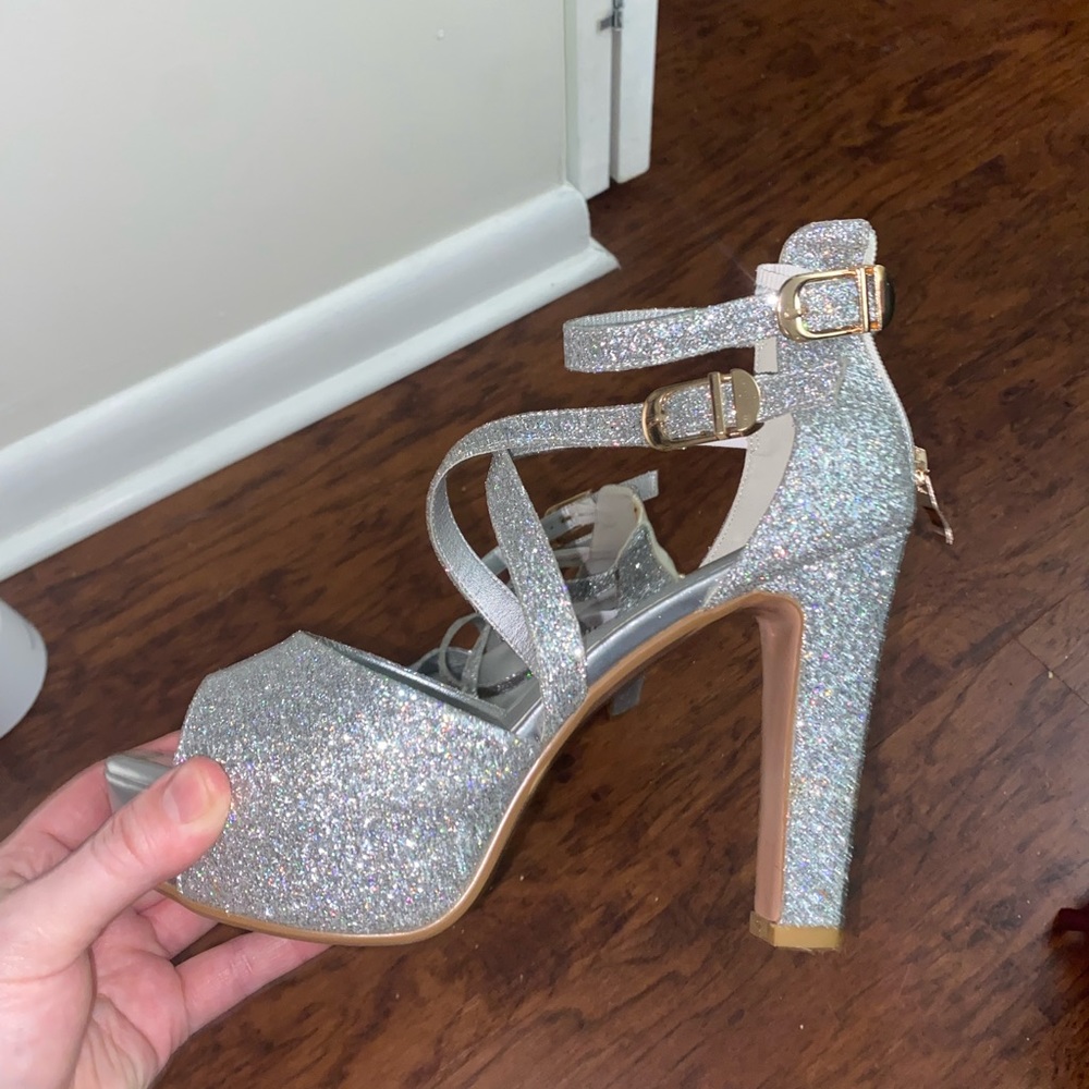 Silver platform heels. Size 10. Lightly worn. 4 3/4- 5 inch heels